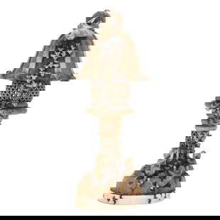 A Japanese Staghorn Carving of a Lantern with Eagle and Monkeys: A Japanese Staghorn Carving of a Lantern with Eagle and MonkeysEdo (1615-1868) or Meiji period (1868-1912), 19th century, very finely carved stag horn with eagle perched atop a lantern staring down at