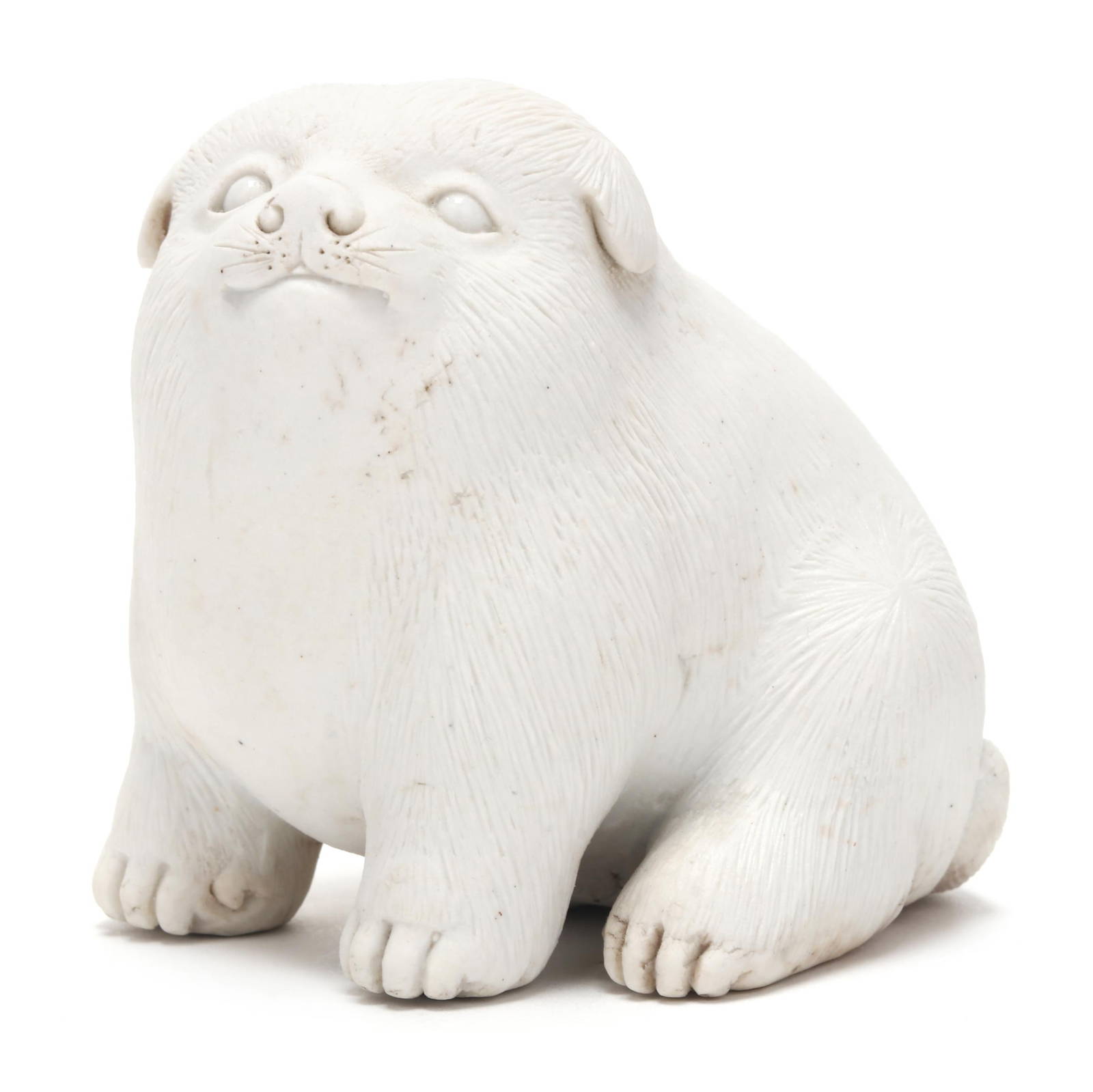 A Japanese White Hirado Porcelain Puppy Okimono