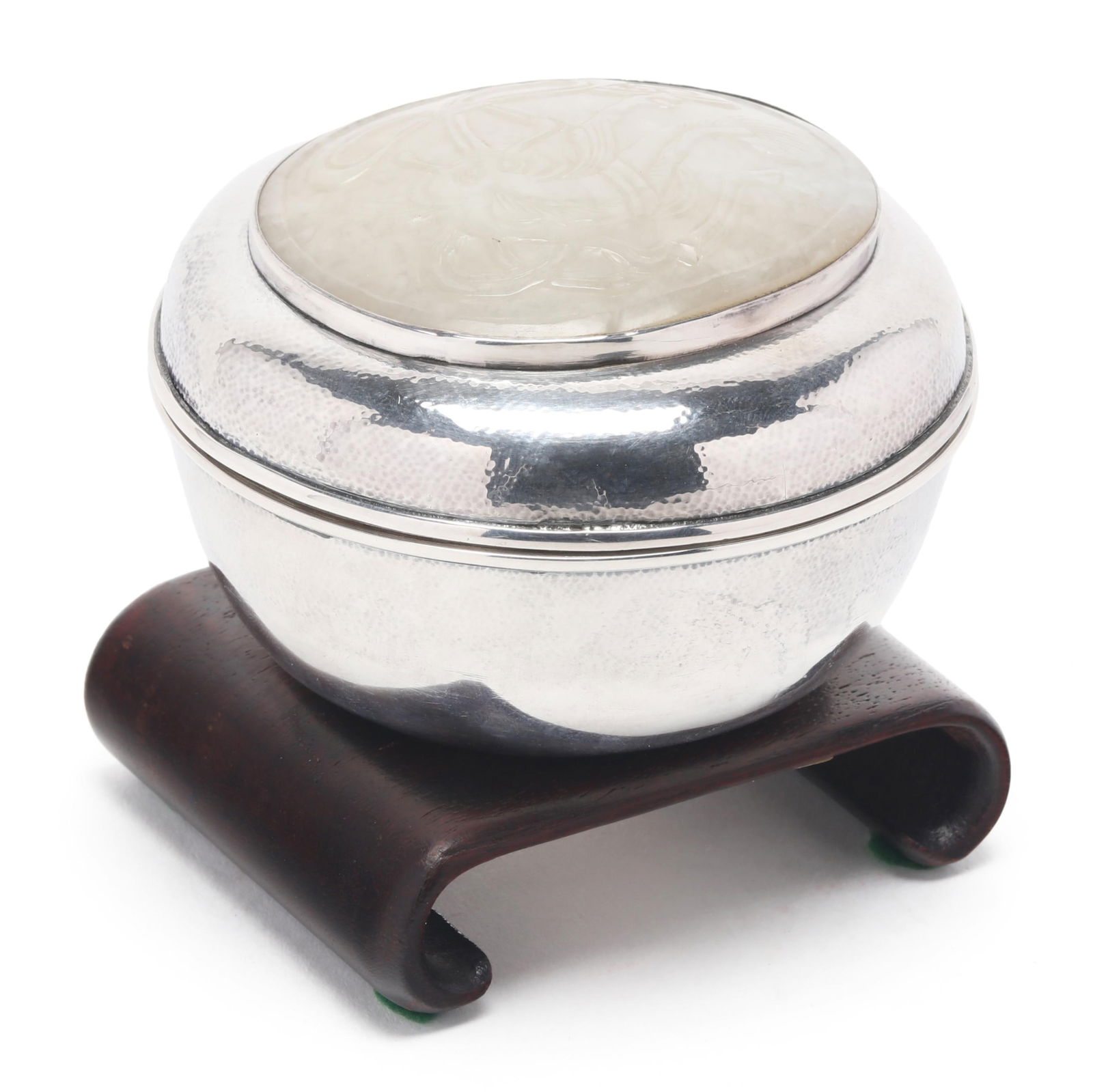 A Japanese Silver and White Jade Box by Miyamoto Shoko: A Japanese Silver and White Jade Box by Miyamoto ShokoMeiji period (1868-1912), silver box featuring a white jade relief carved insert, marked Miyamoto together with jungin or pure silver mark to unde