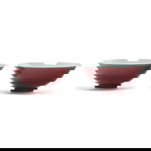 A Pair of Chinese Porcelain Copper Red Glazed Bowls: A Pair of Chinese Porcelain Copper Red Glazed BowlsQing dynasty (1644-1912), 19th century, porcelain bowls with deep red glaze, bluish white glaze to interior and foot of each, unmarked. each 5 7/8 in