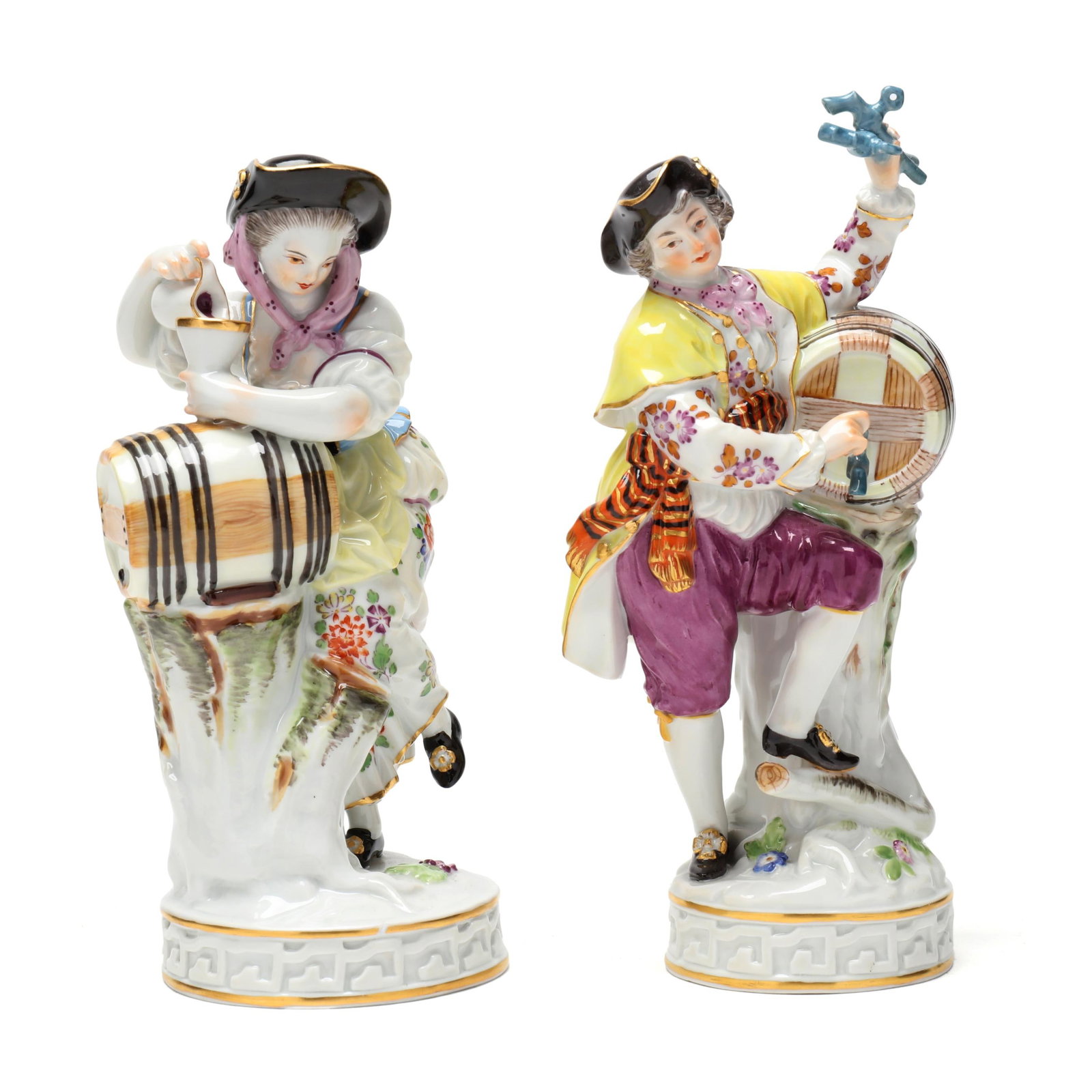Meissen, Two Porcelain "Wine Maker" Figurines: Meissen, Two Porcelain "Wine Maker" FigurinesGermany, circa early 20th century, hand-painted and gilt porcelain figurines of wine growers with cask, after model by Michel-Victor Acier (1736-1799), inc