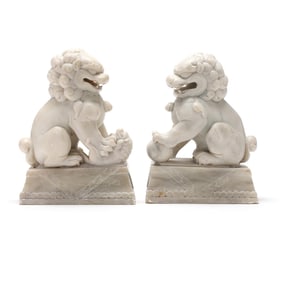 A Pair of Carved Marble Foo Dogs