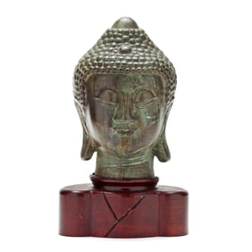 A Bronze Buddha Head with Stand