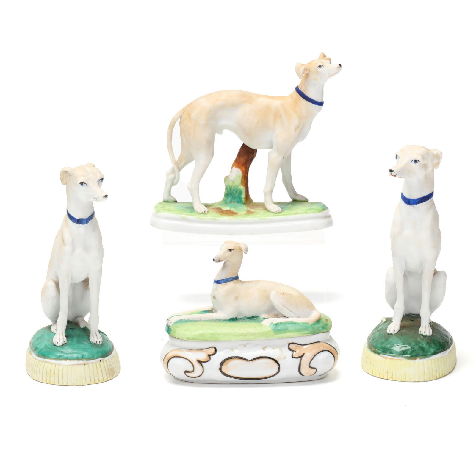 attributed Staffordshire, Four Bisque Porcelain Whippets: attributed Staffordshire, Four Bisque Porcelain WhippetsEngland, mid-19th century, hand-painted and gilt porcelain, to include (2) seated whippets on oval mounds; a standing whippet; and a trinket box