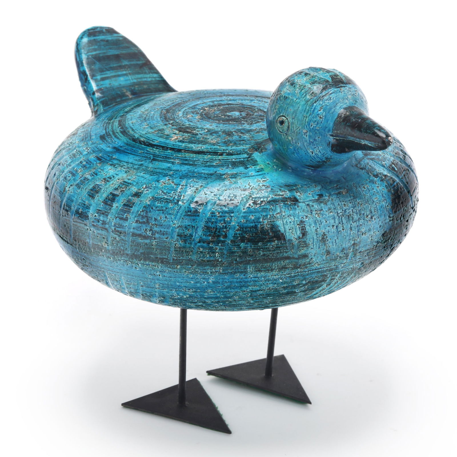Aldo Londi (Italian, 1911-2003) for Bitossi, Rimini Blu Bird: Aldo Londi (Italian, 1911-2003) for Bitossi, Rimini Blu BirdItaly, circa 1960, retailed by Raymor in the U.S., glazed ceramic bird with incised features and metal feet, marked "1702 - B / ITALY" and w