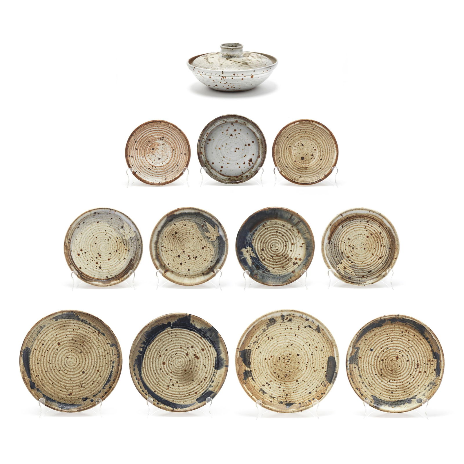 Vivika and Otto Heino (American, 20th century), Twelve Studio Pottery Dinnerware Pieces: Vivika and Otto Heino (American, 20th century), Twelve Studio Pottery Dinnerware PiecesOjai, California, circa 1970-1995 (12) stoneware pieces with mottled white glaze and brown speckled accents to in