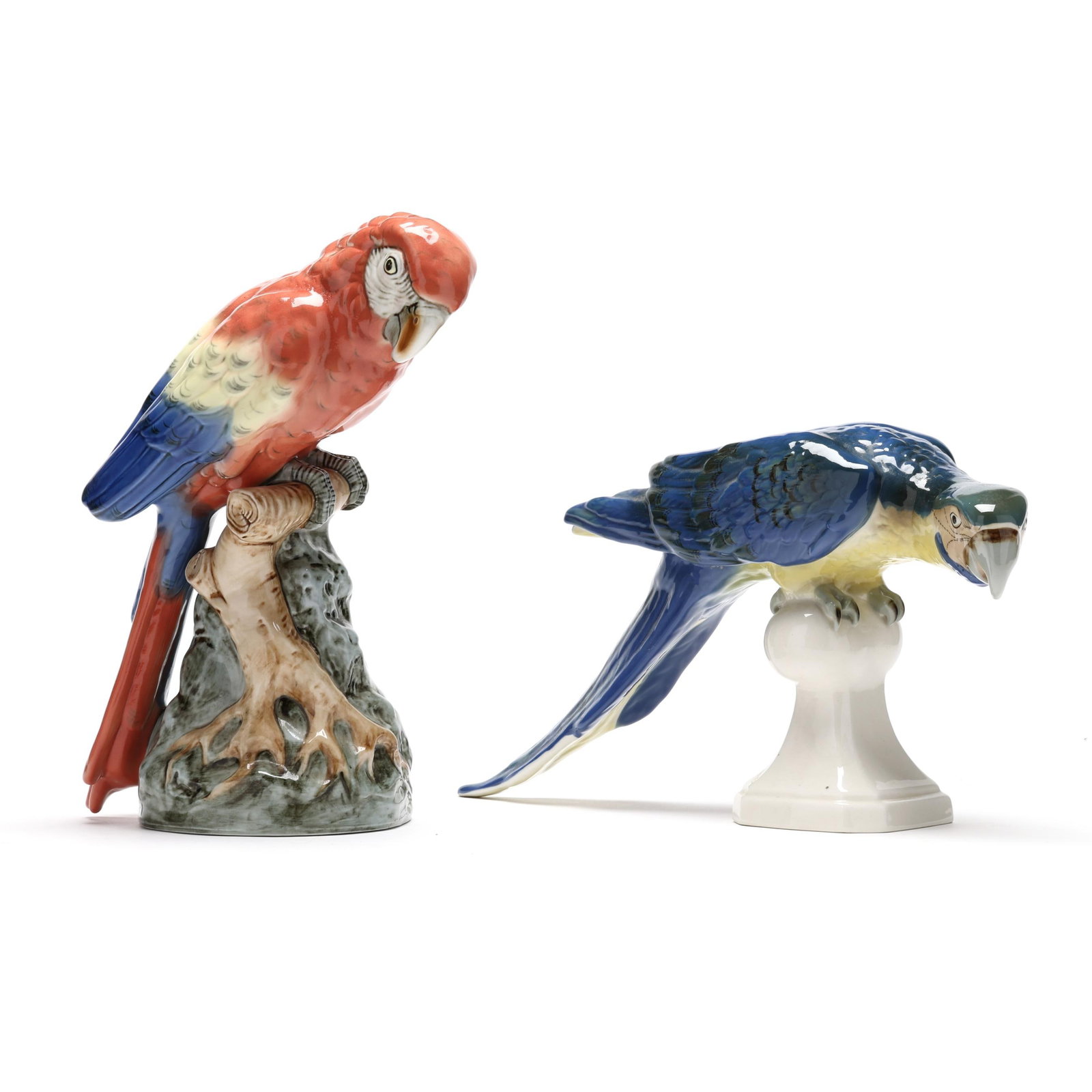 Two Royal Dux Bohemia Porcelain Parrots: Two Royal Dux Bohemia Porcelain ParrotsCzechoslovakia, late 19th century, hand-painted porcelain perched parrots, both marked with company backstamps to underside. Tallest 13 in. Additional high-reso