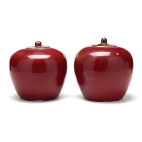 A Matched Pair of Chinese Sang de Boeuf Jars with Covers