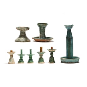 Eight Chinese Green Glazed Ceramic Candlesticks and Oil Lamps