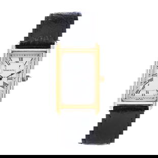 Gold Classic Tank Watch, Tiffany & Co.: Gold Classic Tank Watch, Tiffany & Co. quartz, ETA 976.001, reference number M0430, serial number 13-227, the rectangular gold tank case with signed white dial, black Roman numeral hour markers, and