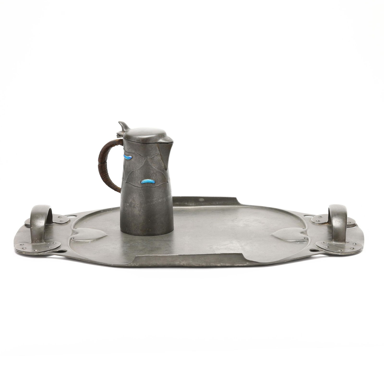 Liberty & Co., Two Tudric Pewter Pieces: Liberty & Co., Two Tudric Pewter PiecesLondon, circa 1905, (2) Art Nouveau pewter pieces designed by Archibald Knox (1864-1933) to include a no. 0278 jug embossed with organic forms and blue enamel de