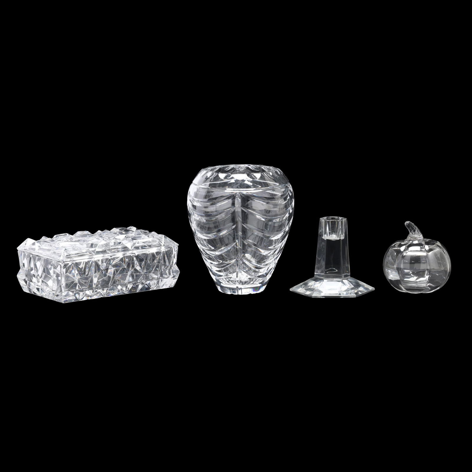 Four Pieces of Tiffany & Co. Crystal: Four Pieces of Tiffany & Co. Crystalincluding a drape pattern vase (6 in.); a Frank Lloyd Wright designed candlestick (3.75 in.); a hollow pumpkin (3.25 in.); and a rectangular lidded "Rock-Cut" dress