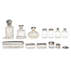 A Collection of Silver Lidded Crystal Dresser Accessories