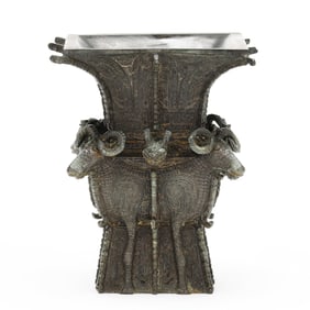 A Chinese Shang Style Archaic Bronze Ram Head  Zun  Vessel