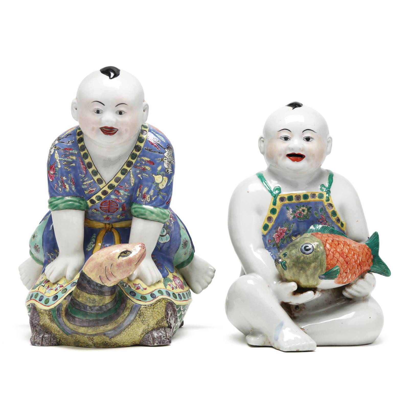 A Pair of Chinese Republic Period Porcelain Figures of Playing Boys