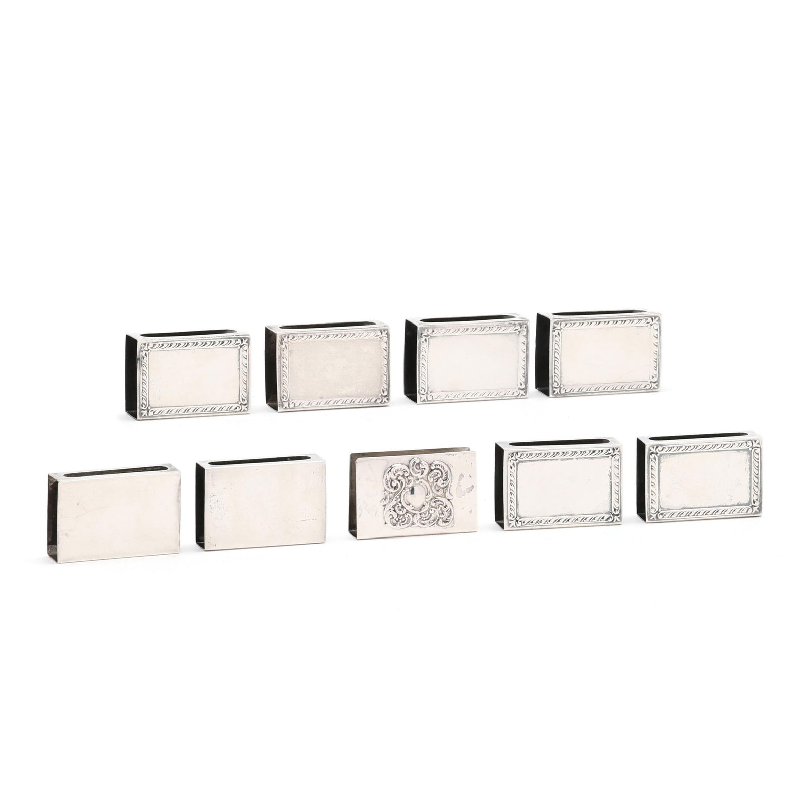 Nine Sterling Silver Matchbox Cases: Nine Sterling Silver Matchbox Casesincluding a set of (6) with mark of Webster featuring a gadrooned edge; a pair of Webster cases; and a Lunt case with repousse cartouche to the front; not monogramme