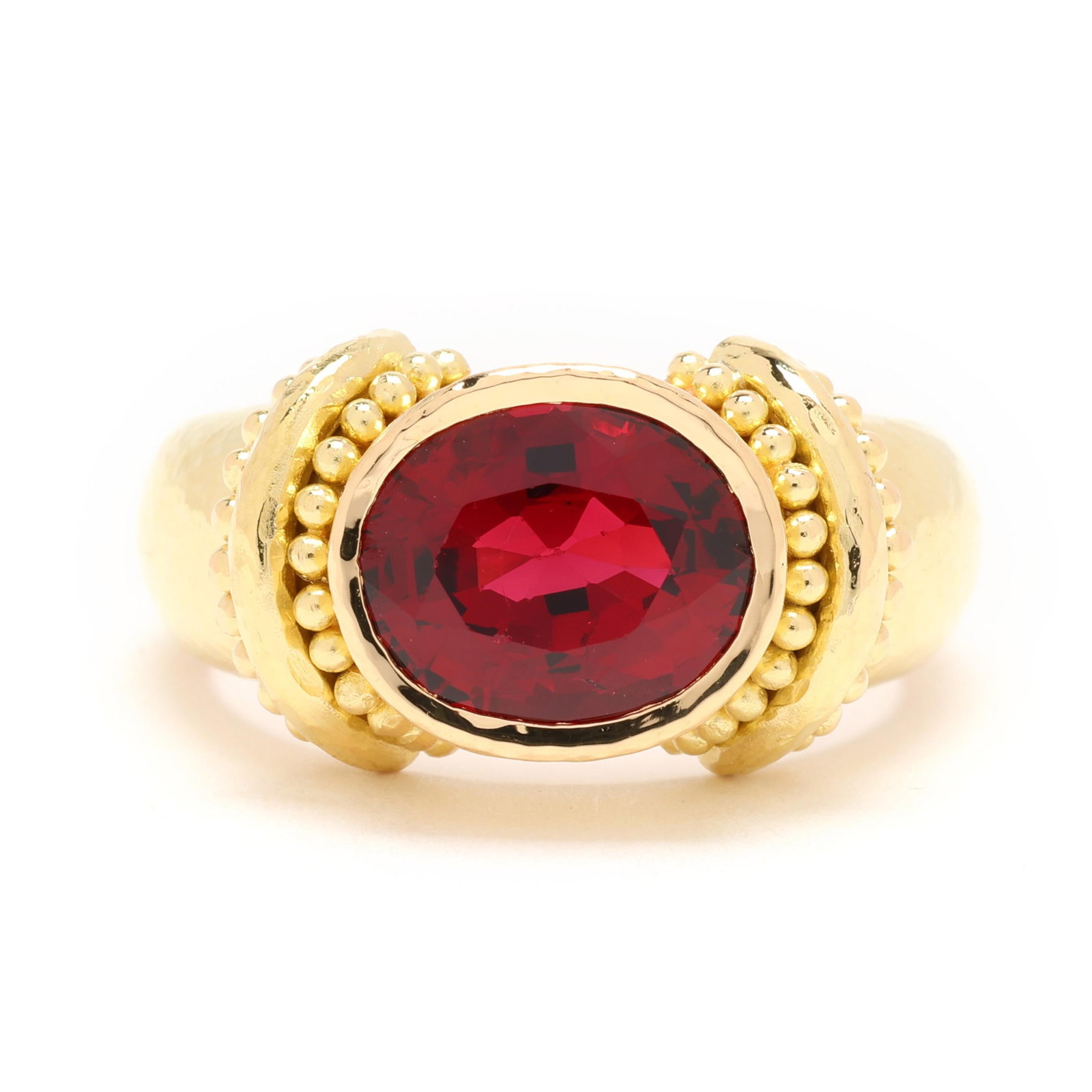 High Karat Gold and Red Spinel Ring, Elizabeth Locke: High Karat Gold and Red Spinel Ring, Elizabeth Lockebezel set to the center with an oval cut red spinel (9.4 x 7.5 x 4.84mm) weighing approximately 2.40 carats, the shoulders with beaded detailing, on