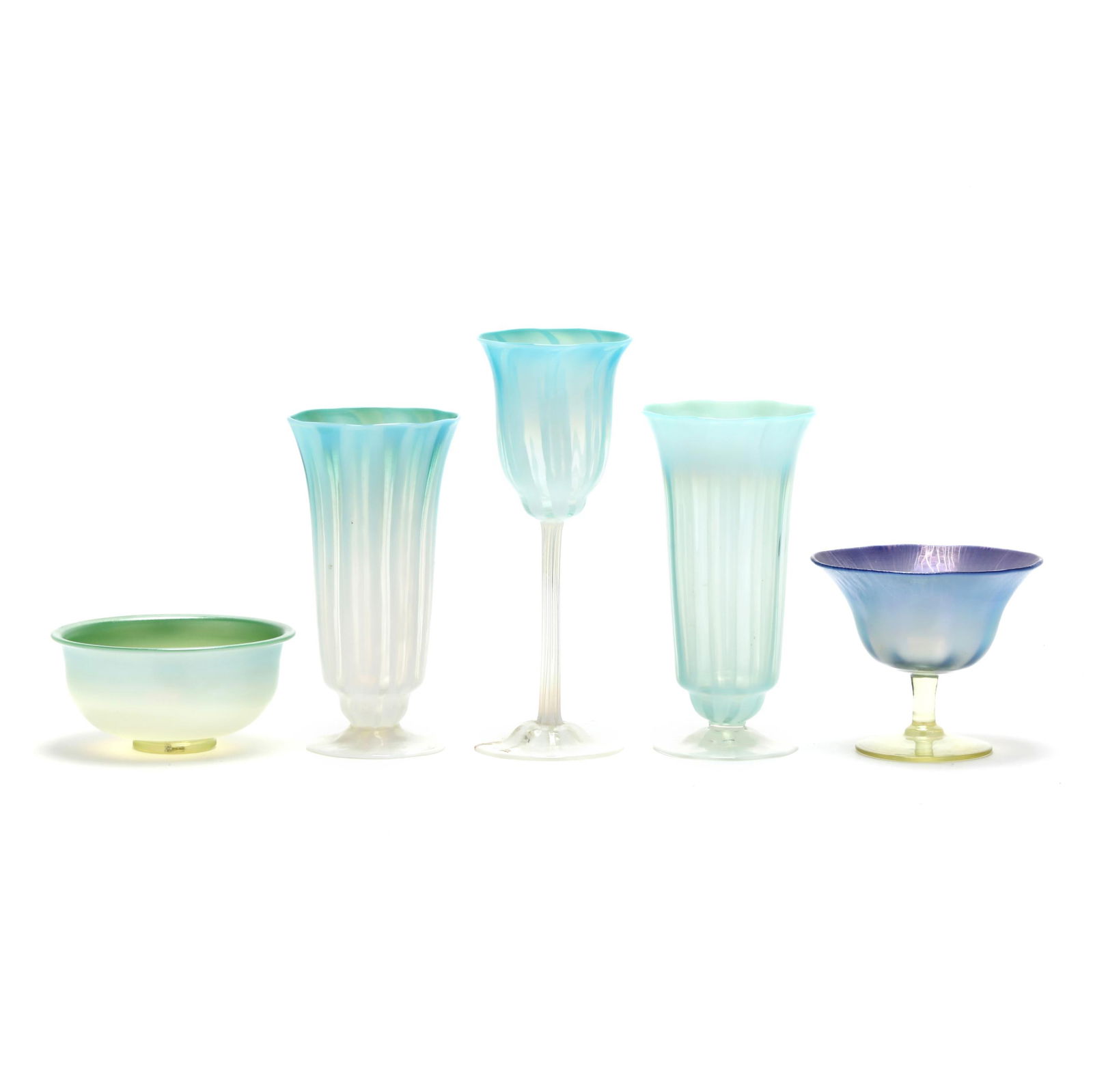Five Pieces of L.C. Tiffany Pastille Glass: Five Pieces of L.C. Tiffany Pastille GlassNew York, circa 1910, including a pair of green opalescent and clear footed vases (6.5 in.); a tall stemmed goblet in green opalescent and clear (8 in.); a vi