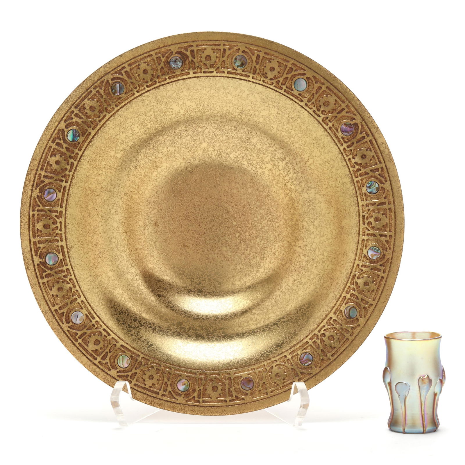 Tiffany Studios Dore Bronze Bowl and Favrile Glass Vessel: Tiffany Studios Dore Bronze Bowl and Favrile Glass VesselNew York, circa 1915, including a gilt textured bronze bowl with geometric rim featuring abalone shell inlay, stamped and numbered 1723 (9 in.