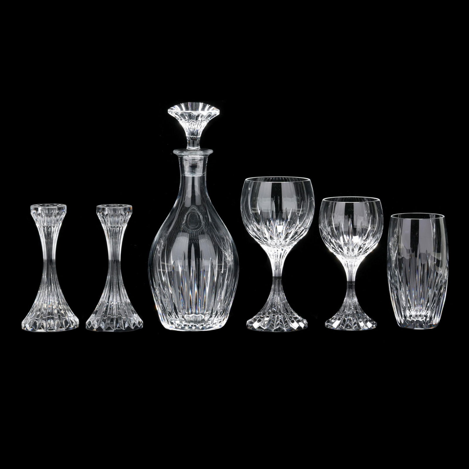 Baccarat, (21) Pieces of Mass√©na Crystal: Baccarat, (21) Pieces of Masséna CrystalFrance, designed 1986, clear crystal with deep linear cut pattern, including (1) decanter with stopper (11 in.); (2) candlesticks (6.25 in.); (9) water goblets