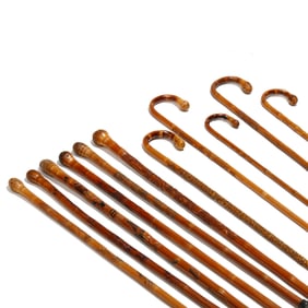 A Collection of (11) Hand Carved Japanese Walking Canes with Inscriptions