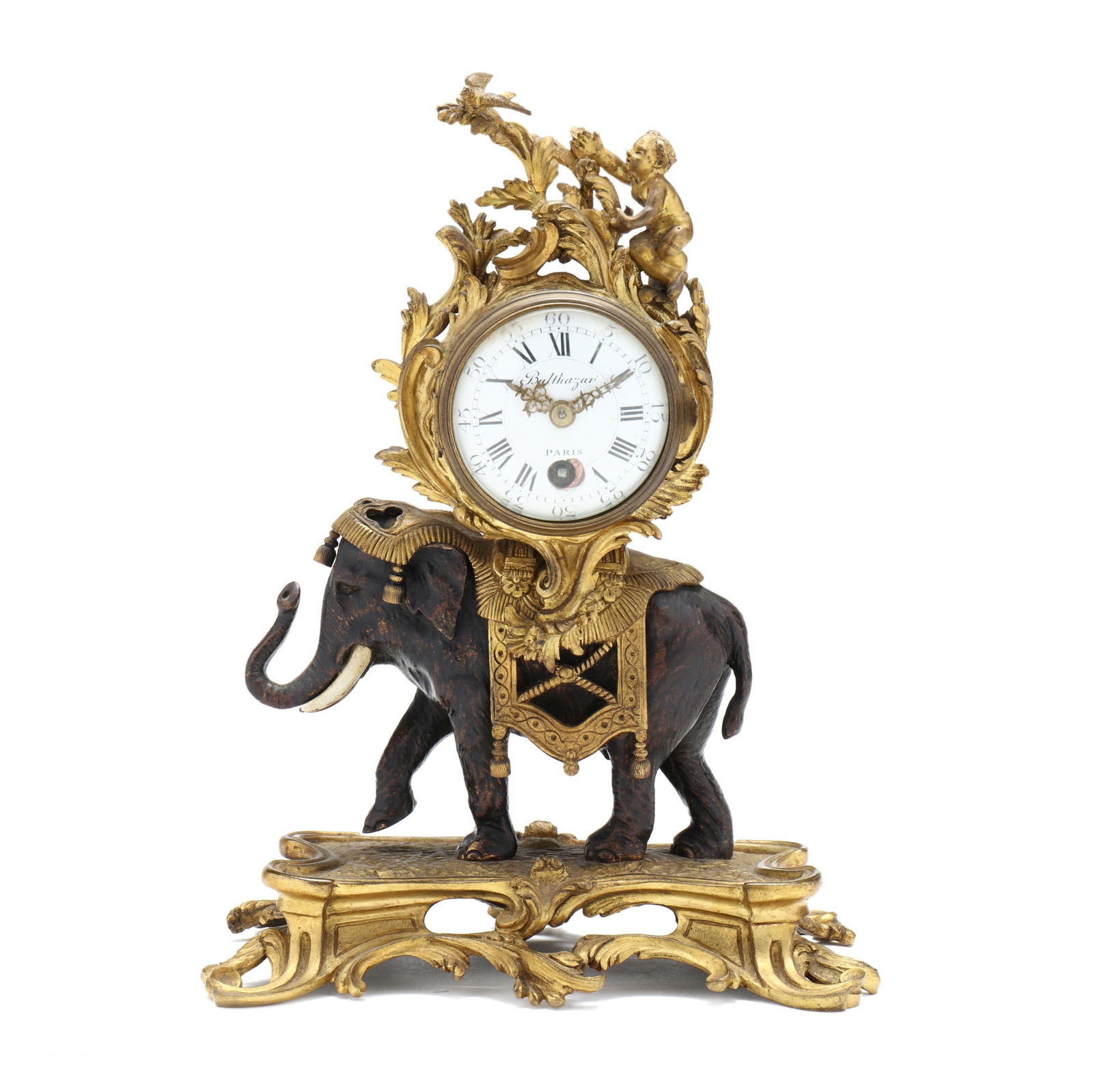 Louis XV Style Bronze Elephant Mantel Clock, Signed Balthazar Paris: Louis XV Style Bronze Elephant Mantel Clock, Signed Balthazar Paris19th century, gilt and patinated bronze, cast in the form of a caparisoned elephant with drum case surmounted by a cherub reaching fo
