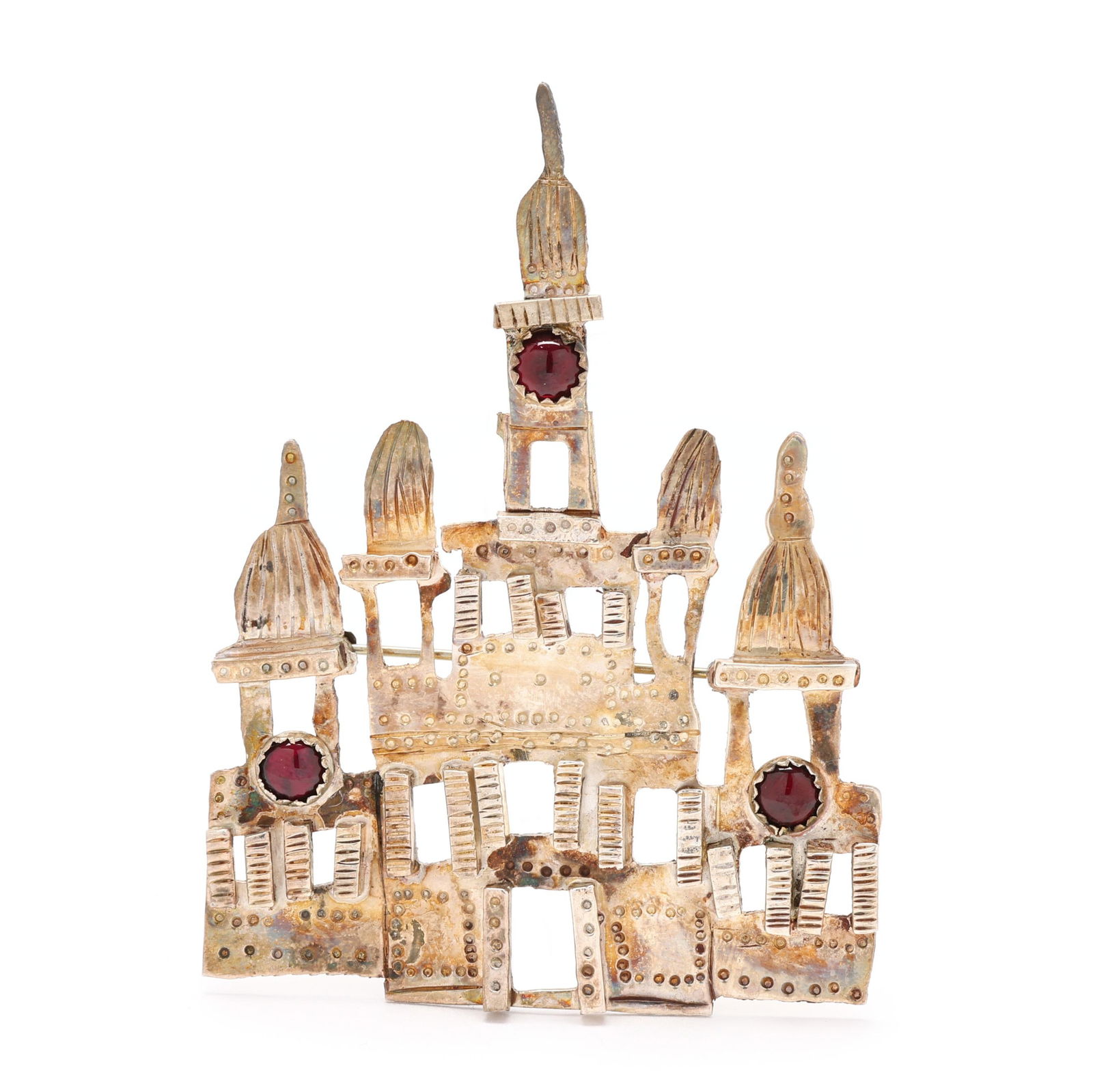 Silver and Gem-Set Architectural Brooch, Unknown Artist: Silver and Gem-Set Architectural Brooch, Unknown Artistthe silver brooch in the form of a palace, bezel set with cabochon cut garnets, completed with a locking pin stem, stamped Sterling. 3 x 2.25 in.