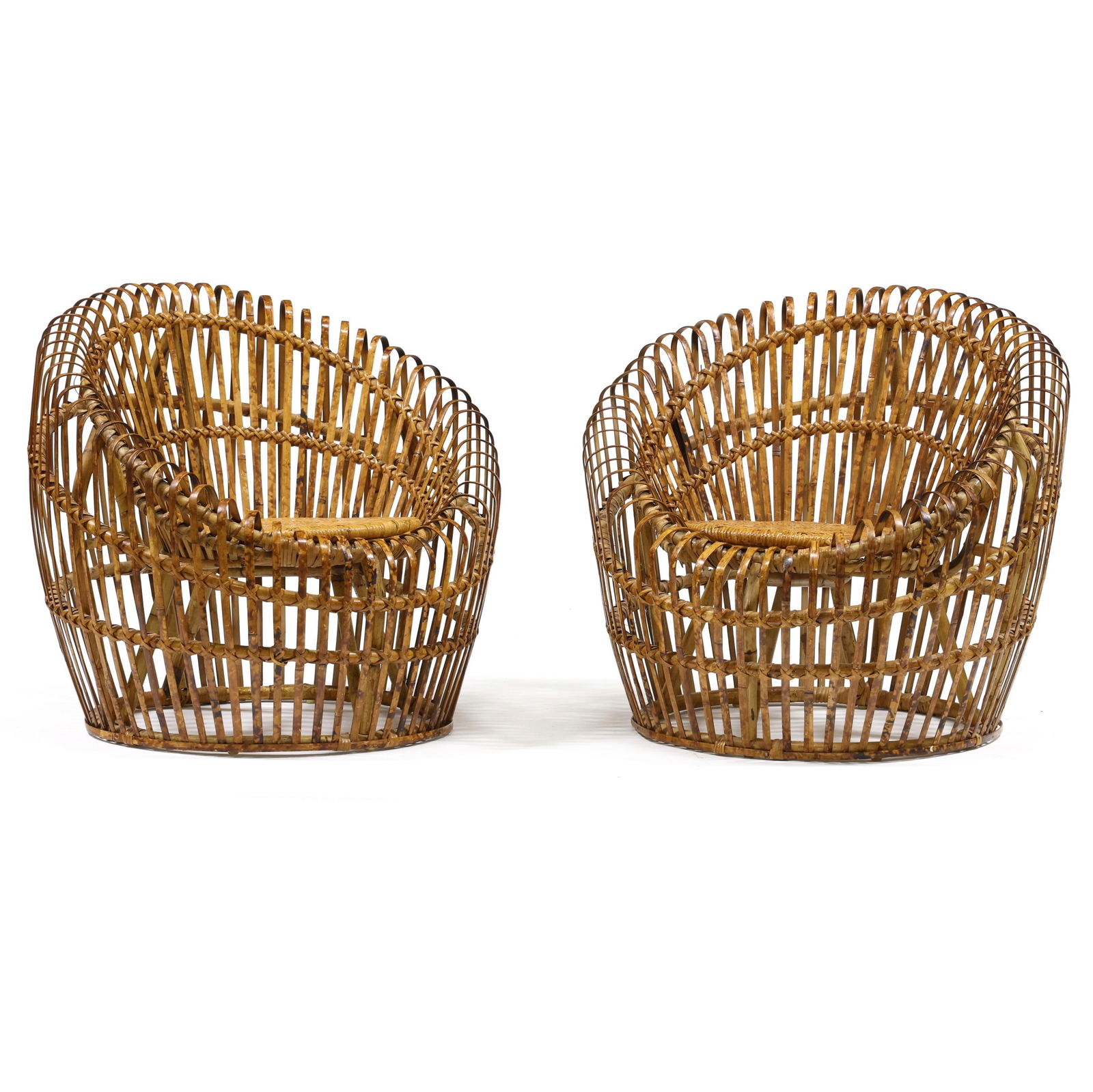 Franco Albini (Italian, 1905-1977), Pair of Rattan Lounge Chairs: Franco Albini (Italian, 1905-1977), Pair of Rattan Lounge Chairs circa 1970, rattan frames with split, bent and burnt rattan surround, woven seat, flush base, unmarked. 32 x 35 in. diameter 