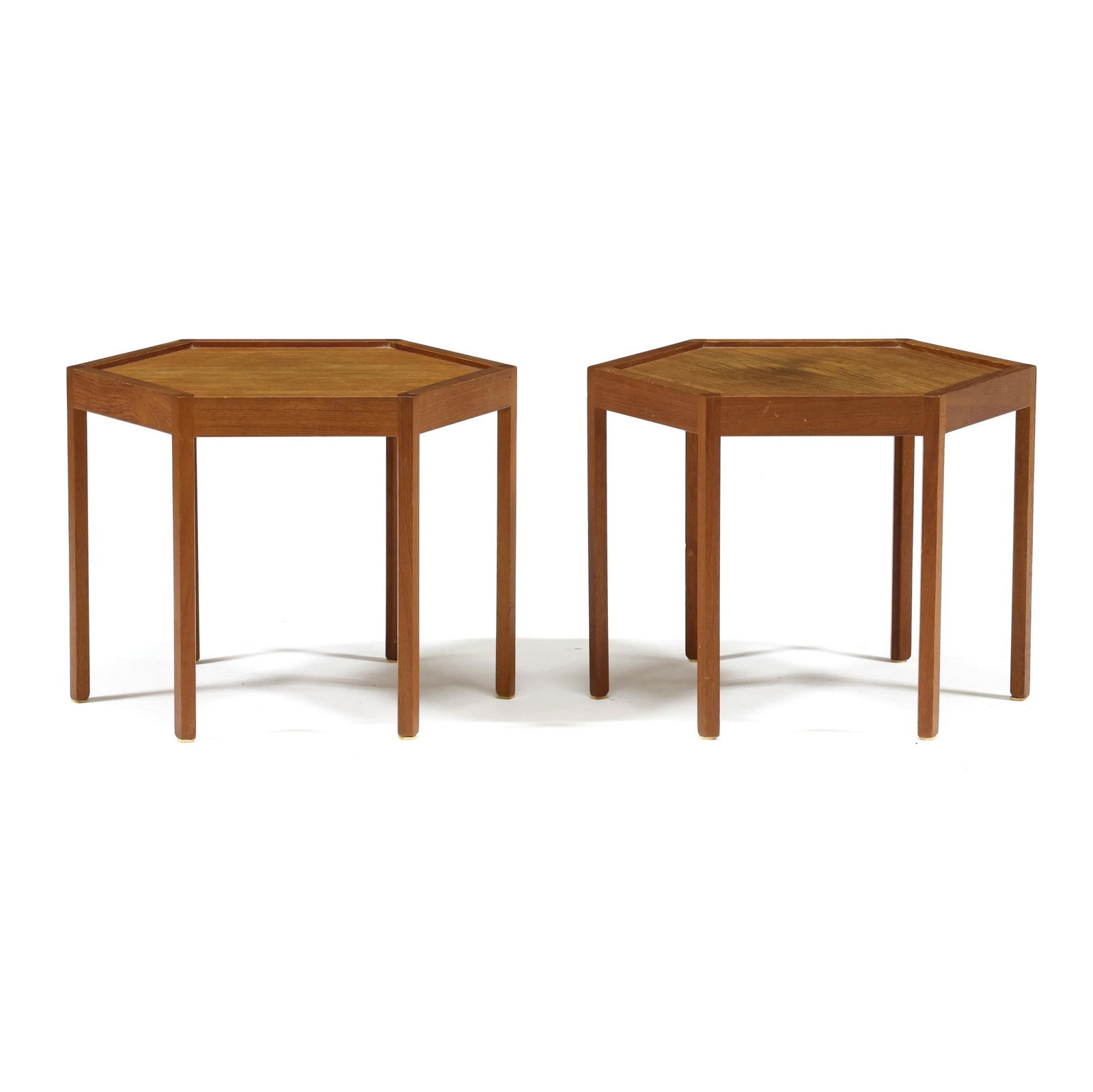 Hans Christian Andersen, Pair of Teak Hexagonal Tables: Denmark, circa 1960, for Artek, stacking form, recessed top, straight legs with interior notched corners, marked. 14.5 x 19 x 16.75 in. Additional high-resolution photos are available at