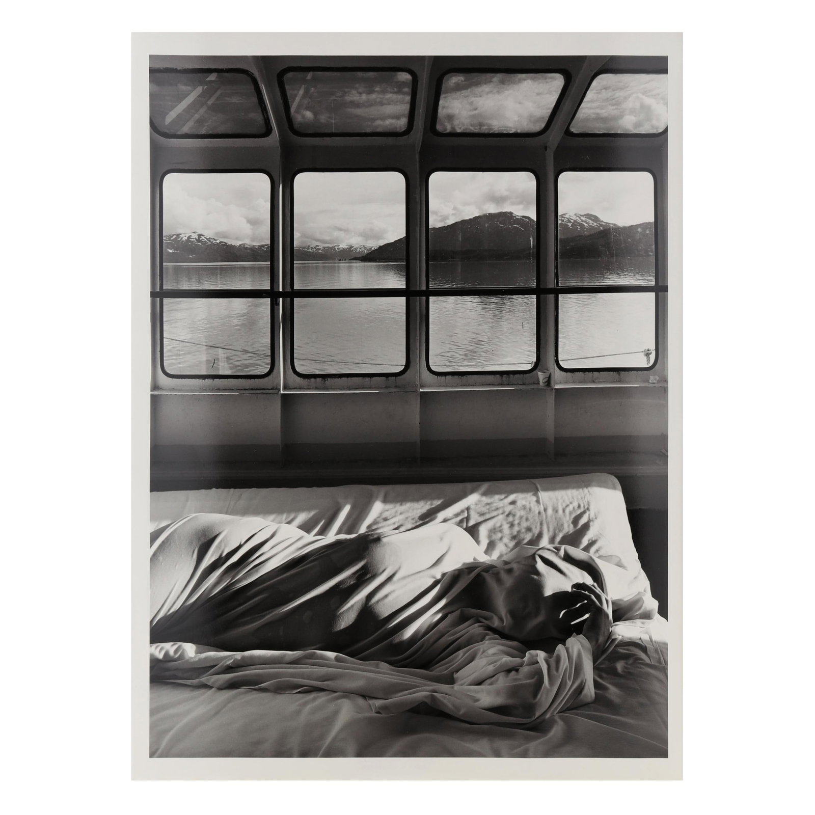 Jerry Uelsmann (American, 1934-2022), Untitled: Jerry Uelsmann (American, 1934-2022), Untitledgelatin silver print, 1983 (negative and print date), pencil signed and dated to verso, also with artist's copyright ink stamp and date, unframed. Image s