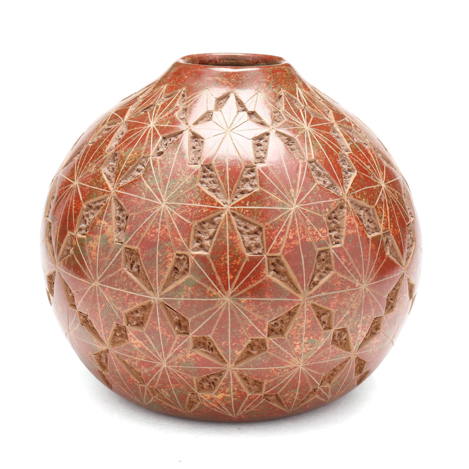 A Signed San Juan de Oriente Carved Pot: A Signed San Juan de Oriente Carved Pot Nicaragua, carved and painted terracotta pot with allover star pattern, inscribed "San Juan de Oriente Nicaragua Alvaro Jersan Blas." to underside. 5 3/4 x 6