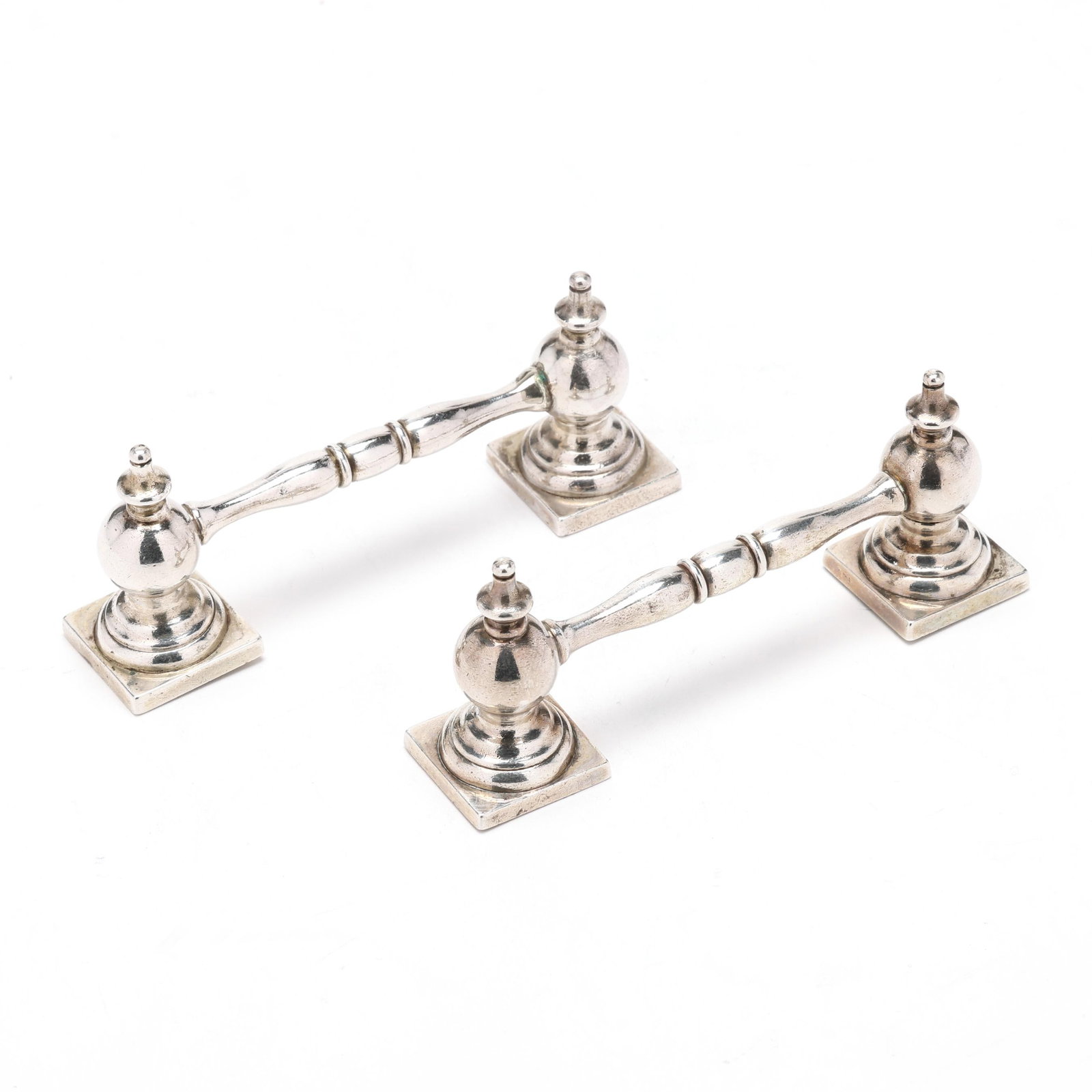 Pair of Edwardian Silver Knife Rests, Mark of Sutherland & Roden: Pair of Edwardian Silver Knife Rests, Mark of Sutherland & RodenSheffield (1901), baluster forms raised on square bases, not monogrammed. 4 1/4 in. 6.05 troy oz. From the Collection of a Lady, William