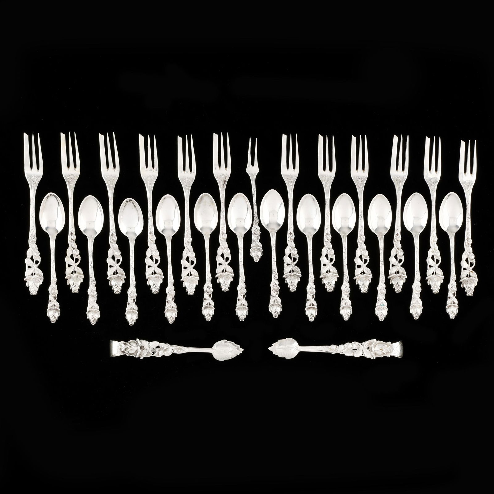 Continental Silver Pastry Service: Continental Silver Pastry Service .800 silver, (27) pieces to include: (12) pastry forks; (12) demitasse spoons; a two tined lemon fork; and (2) pairs of sugar tongs; all with uniform rose handles,