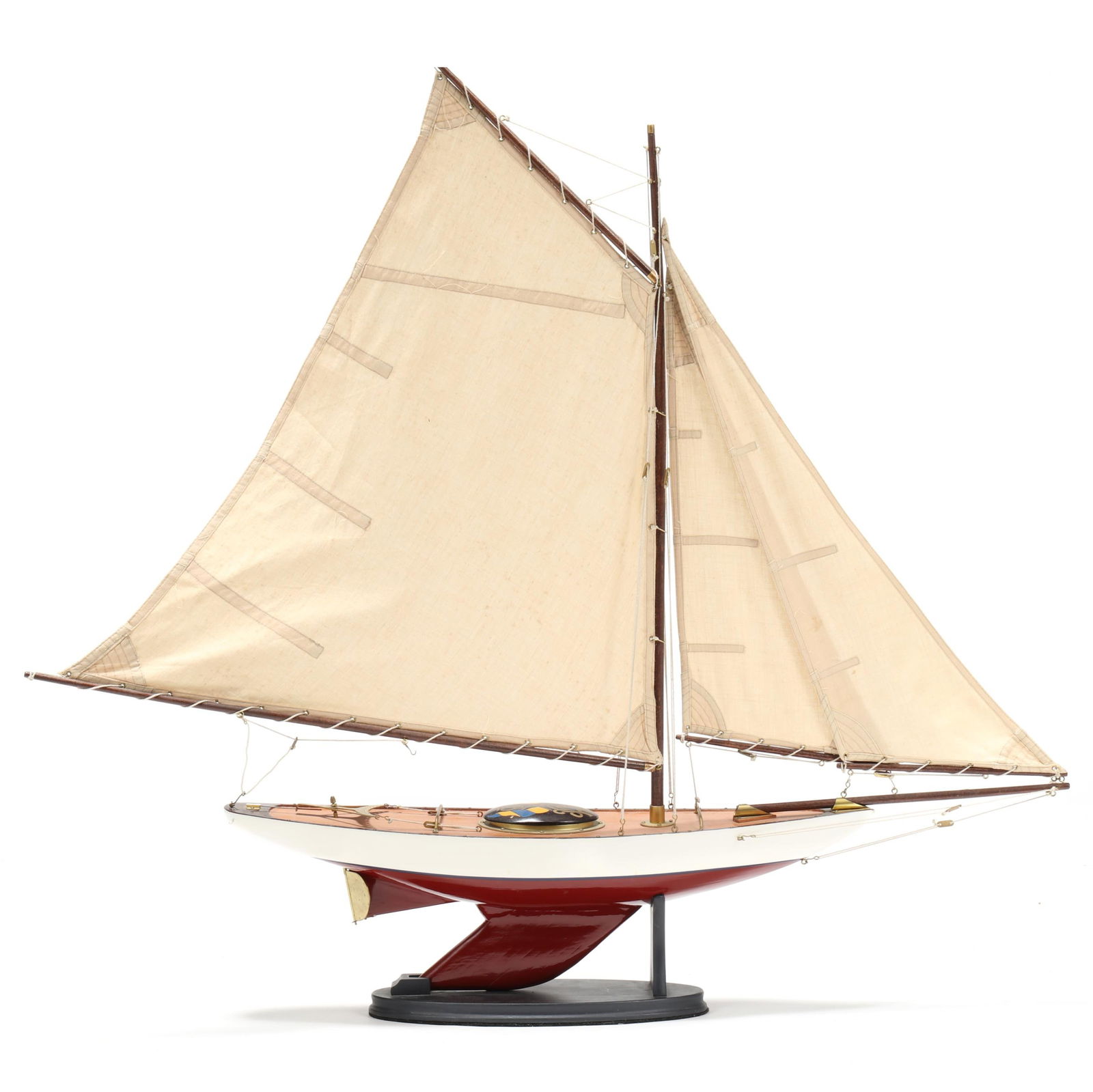 1923 Royal Motor Yacht Club Model Yacht on Stand: 1923 Royal Motor Yacht Club Model Yacht on Standlate 20th century, painted wood with brass toned fittings, having cotton sails string, painted hatch cover inscribed "RMYC 1923," mounted atop a conform