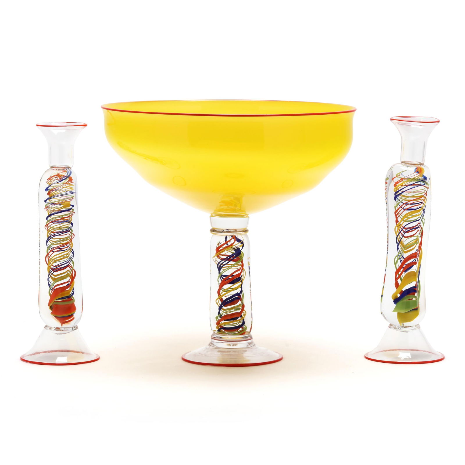 Attributed Murano, Three Piece Art Glass Garniture Set: Attributed Murano, Three Piece Art Glass Garniture Set1995, including a blown yellow glass centerpiece with orange lip rim, tri-paneled stem with multi-color swirl, conical foot with repeating orange
