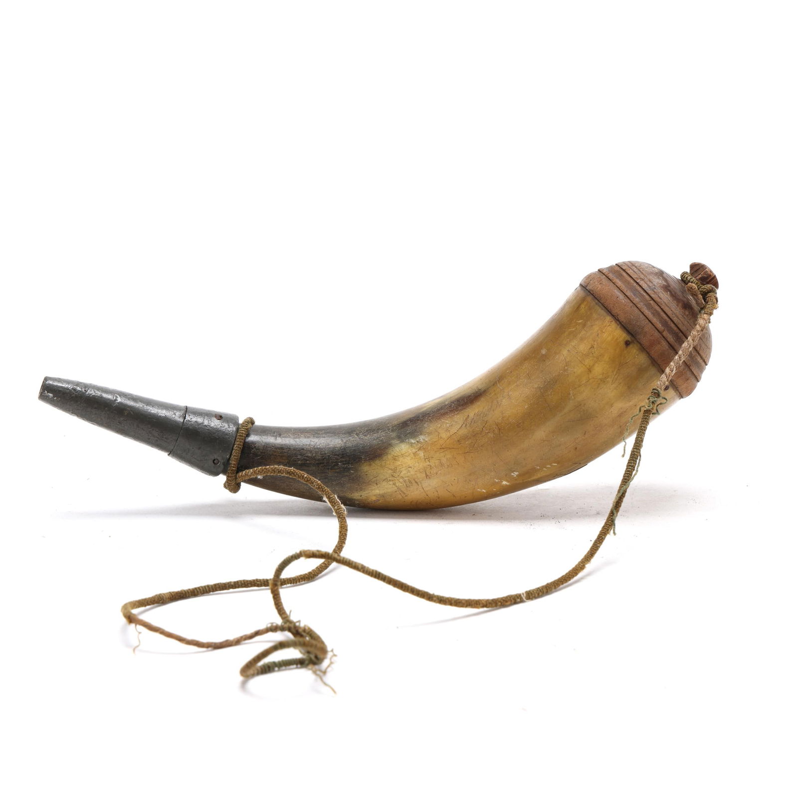 Early Piedmont North Carolina Powder Horn with Pewter Spout: Early Piedmont North Carolina Powder Horn with Pewter SpoutPiedmont, North Carolina, circa 1830s, carved horn body, pewter spout, carved wood plug. Length 10 in. Additional high-resolution photos are