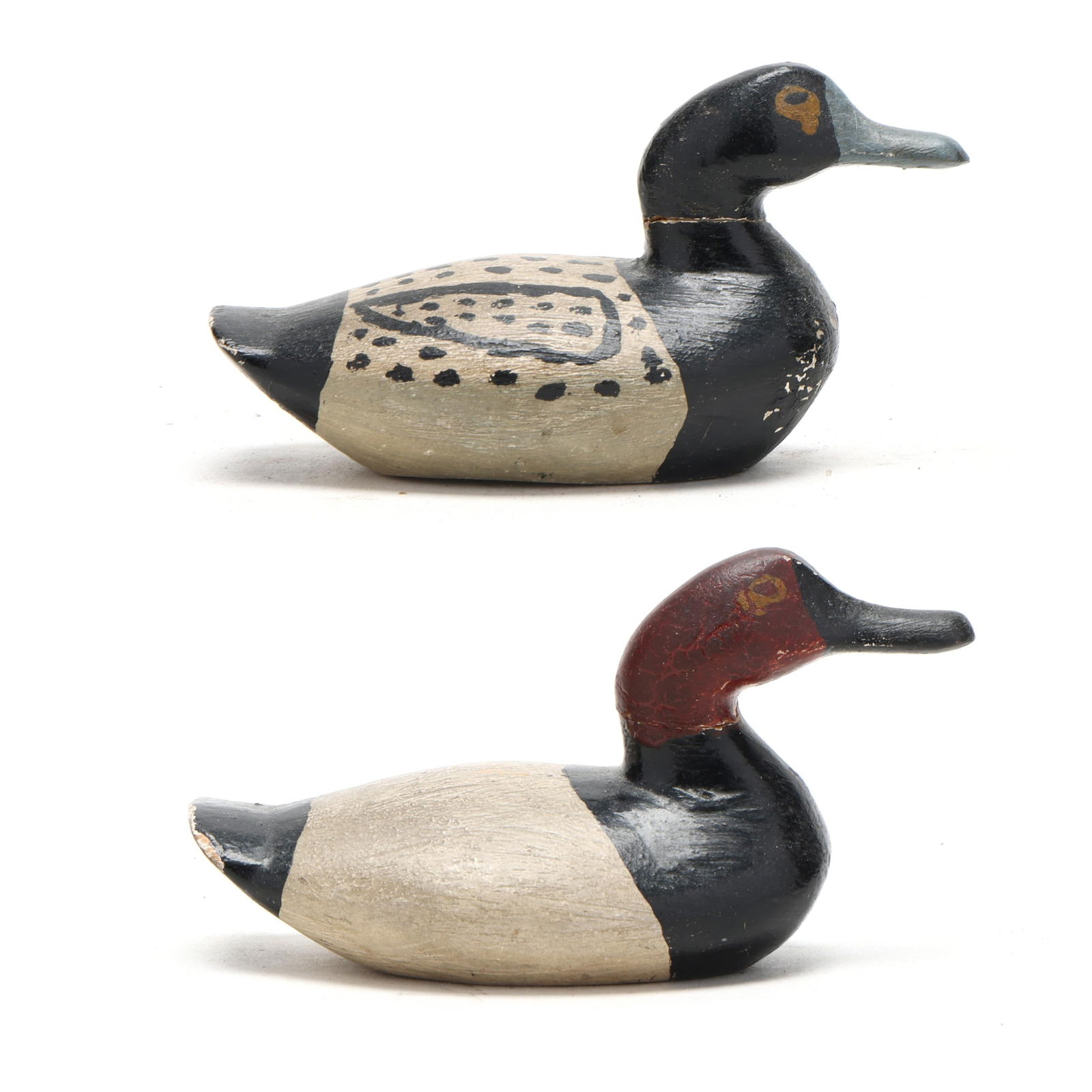 Ivey Stevens (VA, 1876-1947), Miniature Bluebill and Canvasback: Ivey Stevens (VA, 1876-1947), Miniature Bluebill and CanvasbackCreeds, Virginia, circa 1940, carved and painted wood. Length 4 in. From the Personal Collection of Philip and Susan Harvey. Additional h