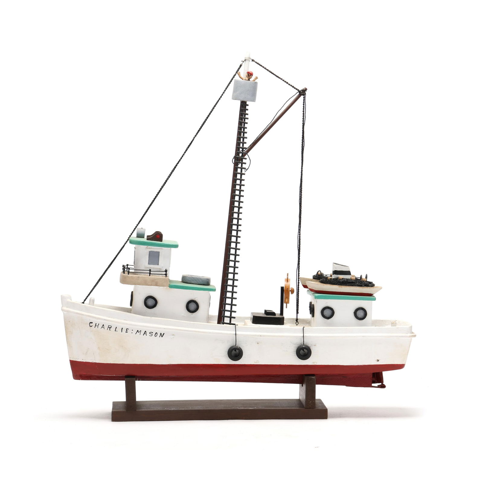 George Jackson, Model of the Charlie Mason Pogie Boat: George Jackson, Model of the Charlie Mason Pogie BoatOcracoke, North Carolina, circa 1980s, carved and painted wood, loosely rests on a custom stand marked Charlie - Mason. Length 25 in., Width 6 in.