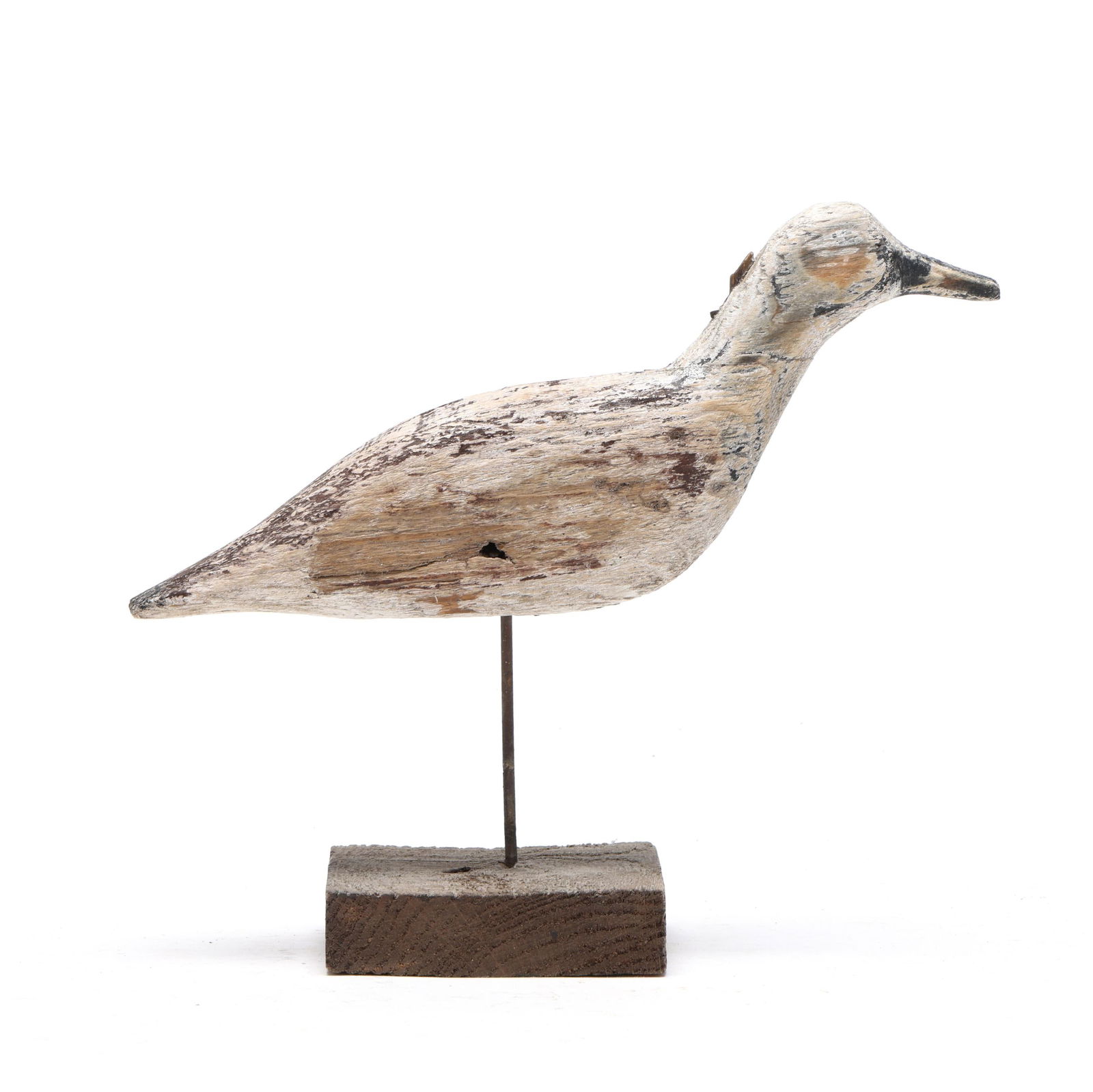 Early Ocracoke Dowitcher: Early Ocracoke Dowitcher Ocracoke, North Carolina, circa 1920, carved and painted wood, loosely mounted to stand. Length 10 in. Collected from Ocracoke Island, North Carolina. Additional