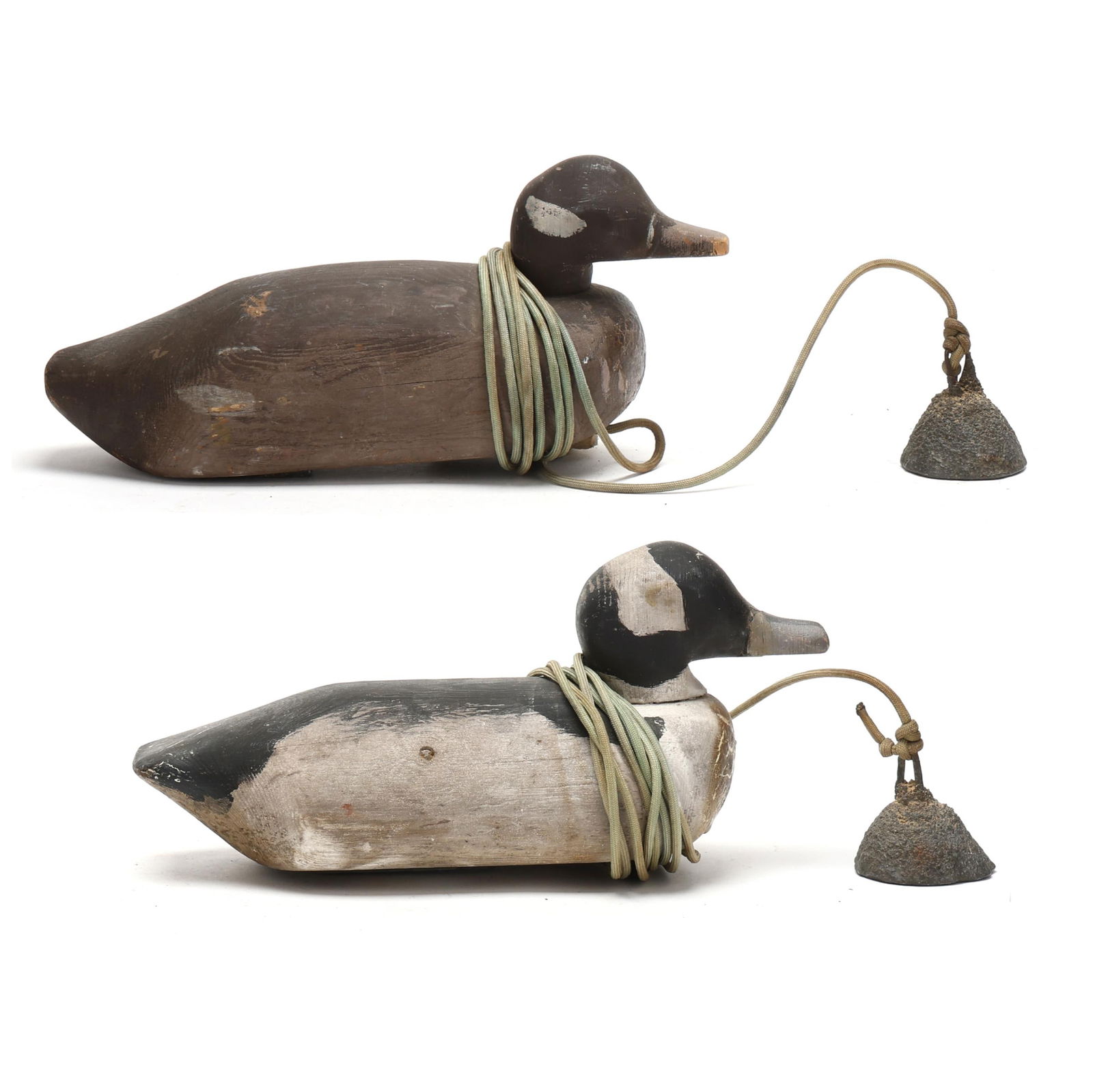 Norman Jessup (NC, 1928-2017), Pair of Bufflehead: Norman Jessup (NC, 1928-2017), Pair of Bufflehead Duck, North Carolina, circa 1950s carved and painted wood, each having the attached molded lead anchor weights. Length 11 in. each Additional