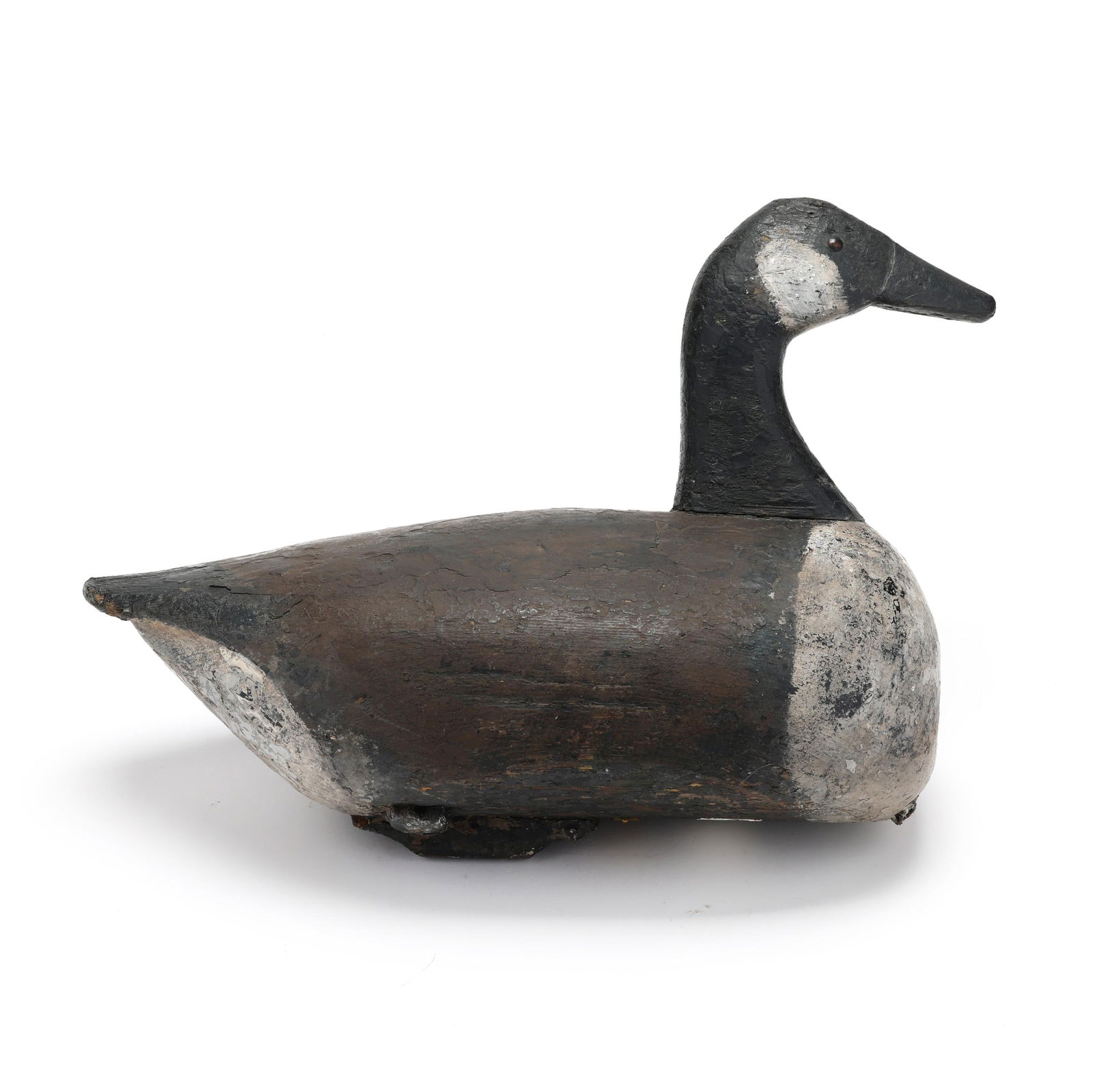 Rufus Roberts (NC, 1897-1954), Goose: Rufus Roberts (NC, 1897-1954), GooseChurches Island, North Carolina, circa 1930s, carved and painted wood, tack eyes, Charlie Hunter's copper collection tag. Length 17 in. An extremely rare species fo