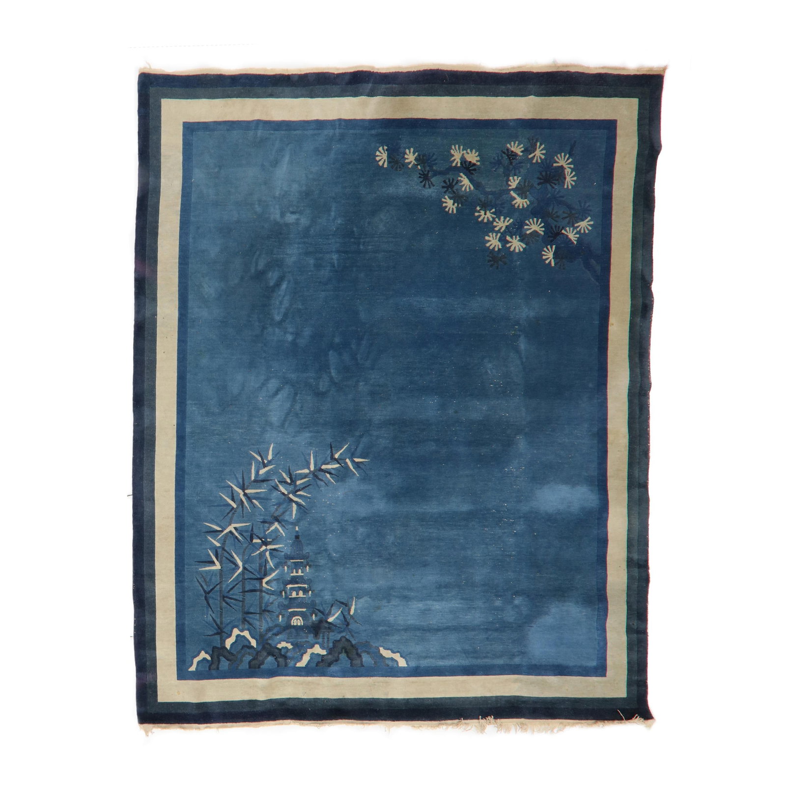 A Chinese Art Deco Blue Pagoda Rug: A Chinese Art Deco Blue Pagoda Rug wool on cotton foundation; the blue field with foliate motifs to two corners in cream and blue shades, with wide striped borders. 9 ft 11 in x 11 ft 7 in From the Co