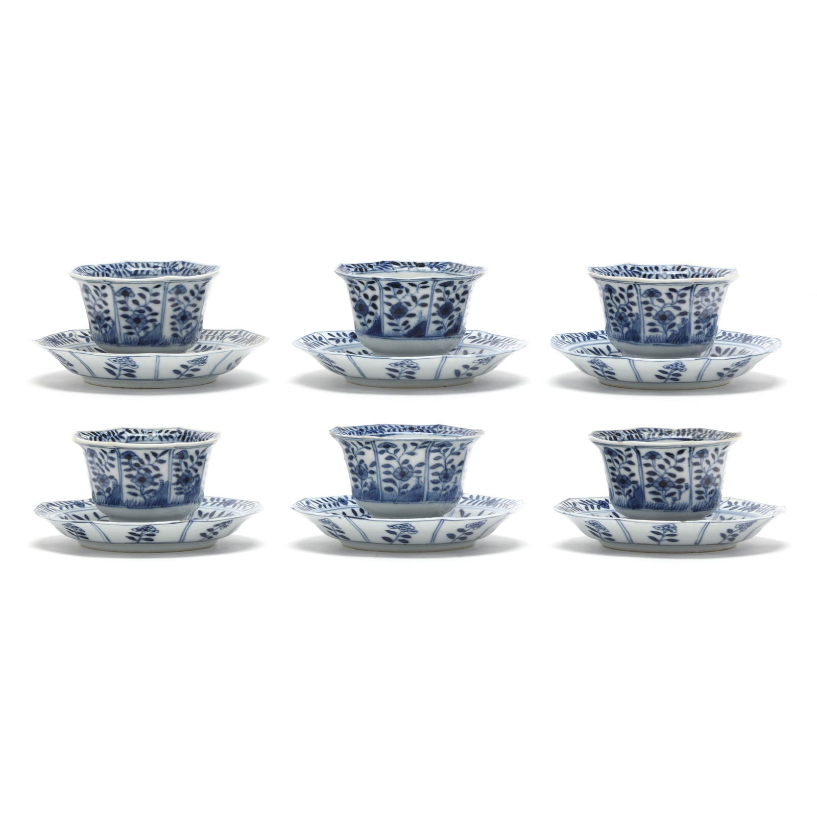 A Set of Six Chinese Kangxi Blue and White Octagonal Tea Cups and Saucers: A Set of Six Chinese Kangxi Blue and White Octagonal Tea Cups and SaucersKangxi period (1662-1722), porcelain hand-painted in underglaze blue, six octagonal cups and saucers, decorated with floral pat
