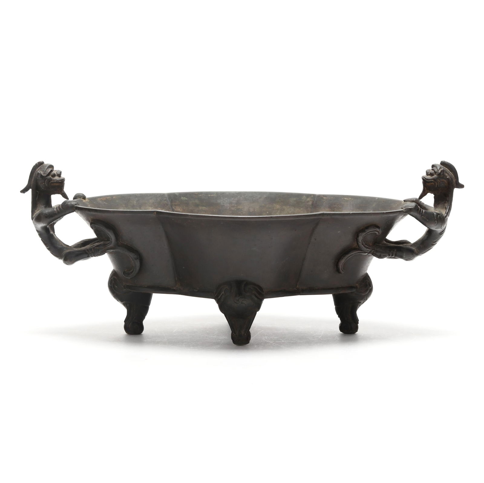 A Chinese Bronze Censer with Chilong Handles: A Chinese Bronze Censer with Chilong HandlesQing dynasty (1644-1912), probably 18th century, the oval body cast in lobed panels and raised on three mask-form feet, the rim flanked by a pair of elabora