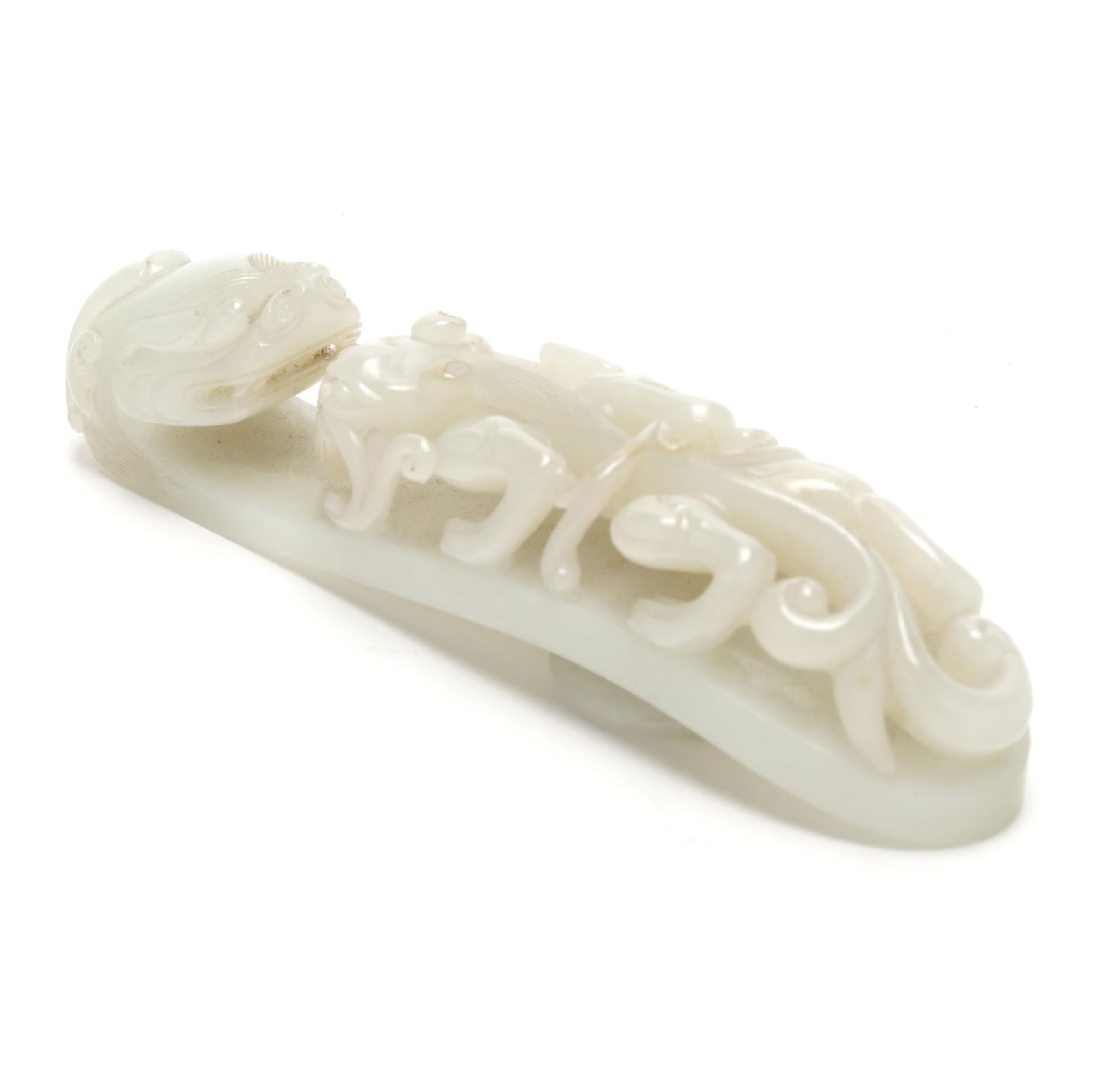 A Chinese White Jade Chilong Dragon Belt Buckle: A Chinese White Jade Chilong Dragon Belt BuckleQing dynasty (1644-1912), 18th or 19th century, white jade finely carved with a dragon head hook and raised chilong dragon on handle, reverse side is smo