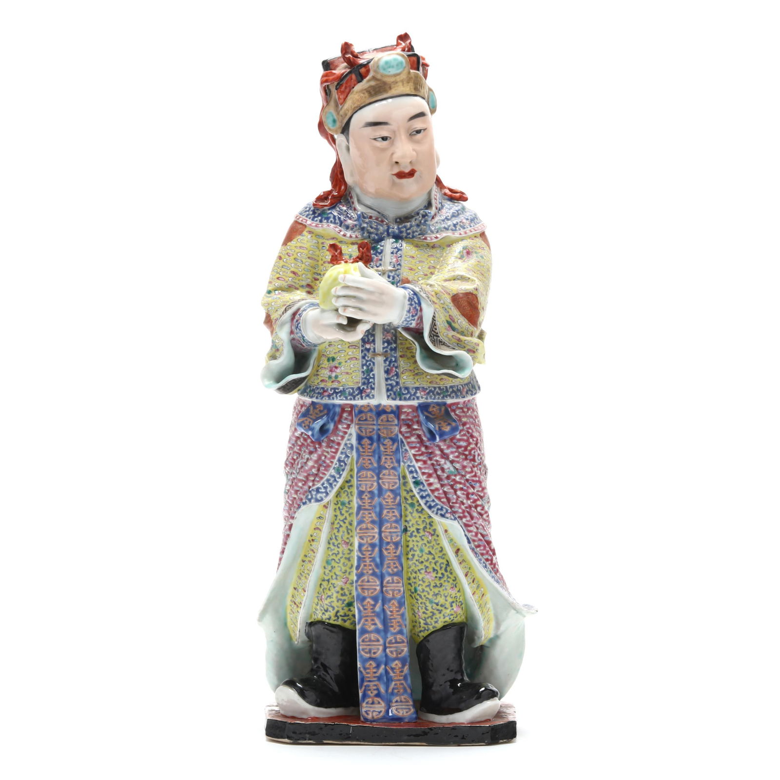 A Chinese Porcelain Famille Rose Figure of an Immortal: A Chinese Porcelain Famille Rose Figure of an Immortal Republic period (1912-1949), a porcelain standing figure hand-painted in vibrant famille rose palette, he holds an item, perhaps a large peach, a