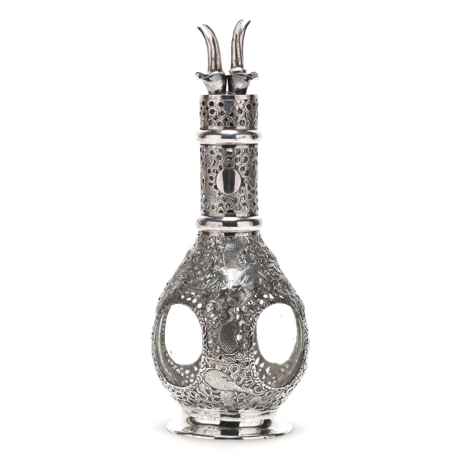 A Chinese Export Sterling Silver Overlaid Glass Decanter, Mark of Tackhing: A Chinese Export Sterling Silver Overlaid Glass Decanter, Mark of Tackhinglate 19th century, Hong Kong, the four chamber glass bottle featuring an openwork sterling overlay with chrysanthemum flowers,