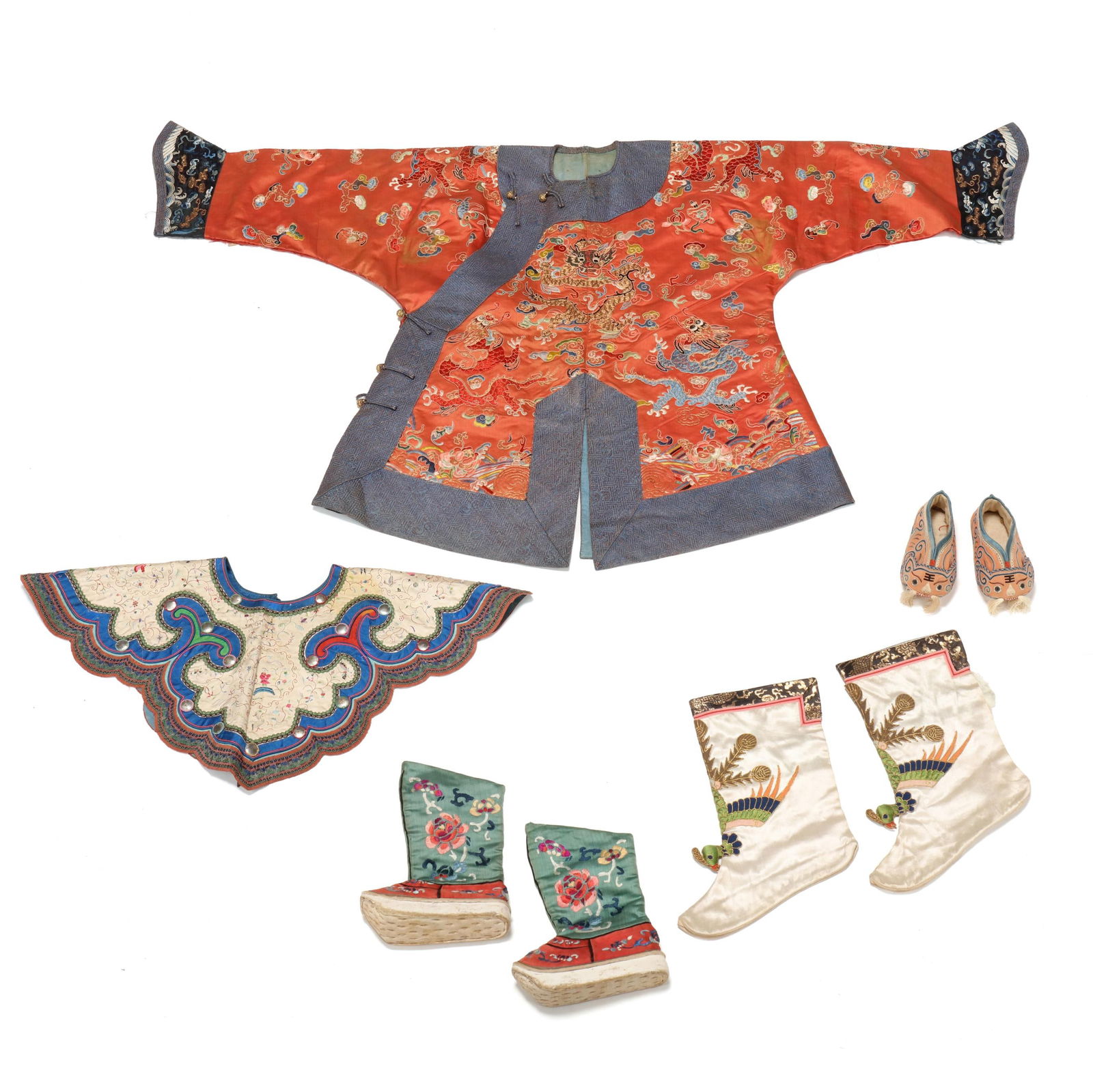 A Selection of Chinese Silk Embroidered Textiles: A Selection of Chinese Silk Embroidered TextilesQing dynasty (1644-1912), 19th century, includes an apricot ground silk dragon court jacket (Hanging 27 1/2 x 49 in.)(scattered stains; separation and t
