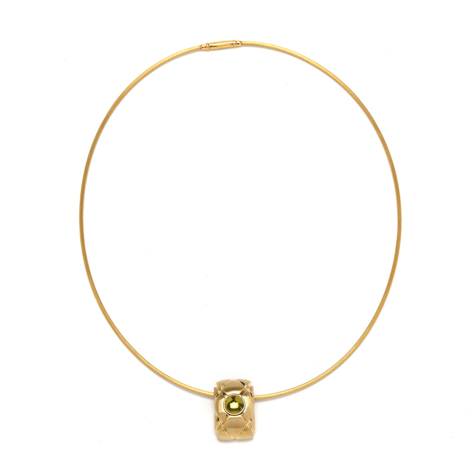 Gold and Peridot Pendant Necklace, Montblanc: Gold and Peridot Pendant Necklace, Montblancthe gold rectangular slide pendant with matelassé motif centered on a bezel set round cabochon cut peridot (6.5mm) and suspended from a matte gold snake ch