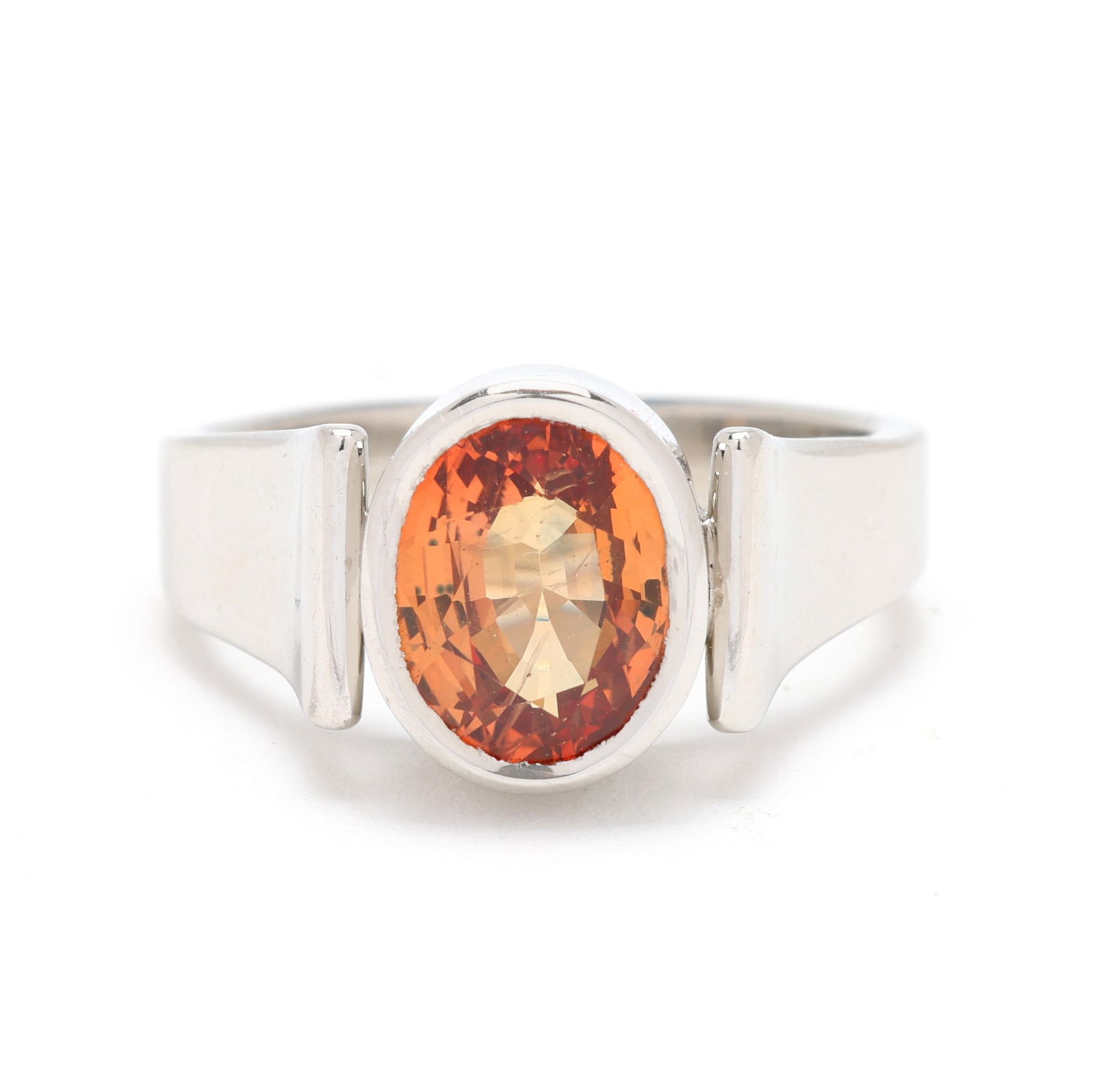 Platinum and Orange Sapphire Ring, Tony Nemyer for Grimball Jewelers: Platinum and Orange Sapphire Ring, Tony Nemyer for Grimball Jewelerscentered on a bezel set oval cut orange sapphire (8.6 x 6.7 x 5.53mm) weighing approximately 2.75 carats, stamped with maker's marks